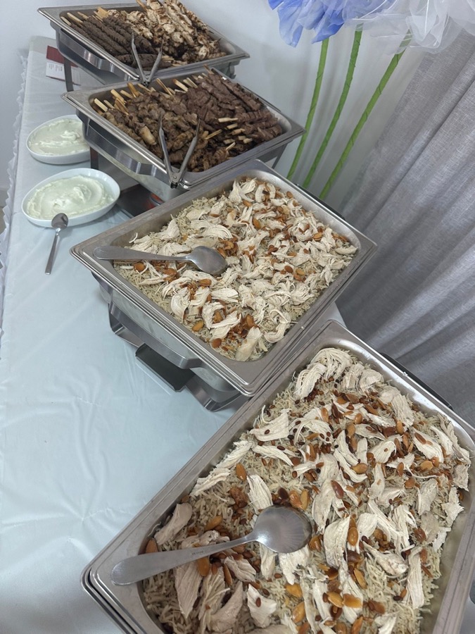 Chafing dishes with skewers and rice for a large event